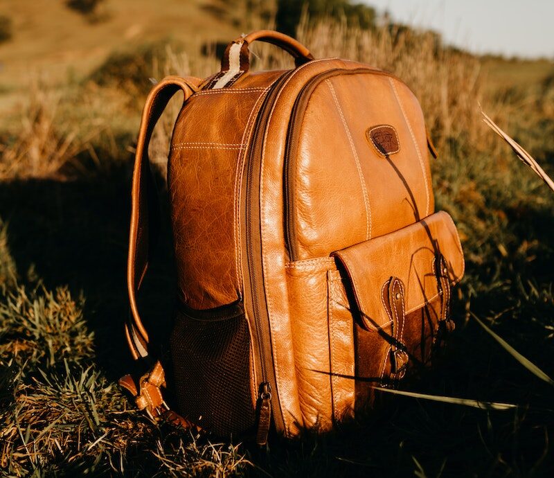 Gun Bag Brown Leather Backpack On A Grassfield